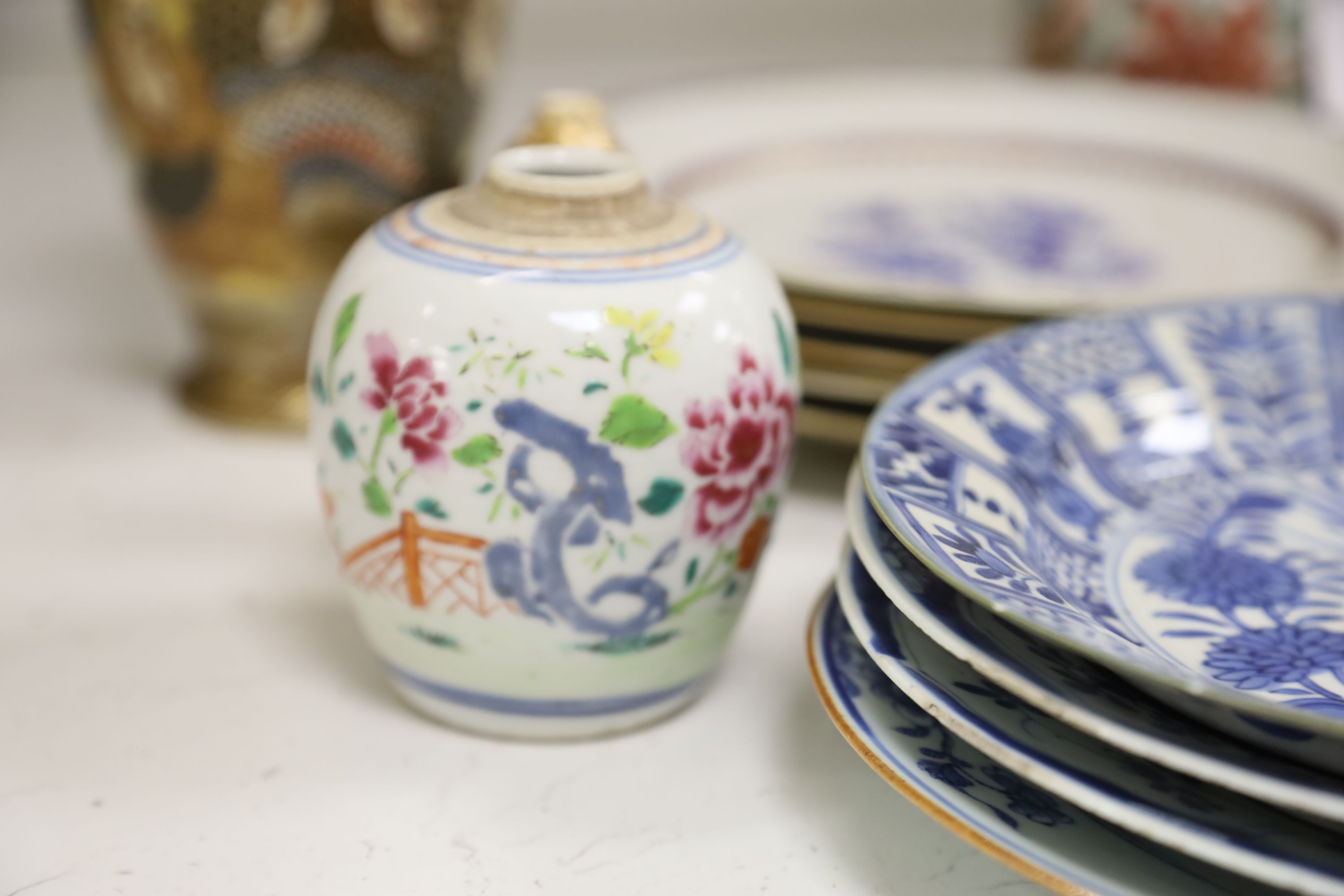 A collection of mixed Asian ceramics, including various Chinese blue and white export plates,